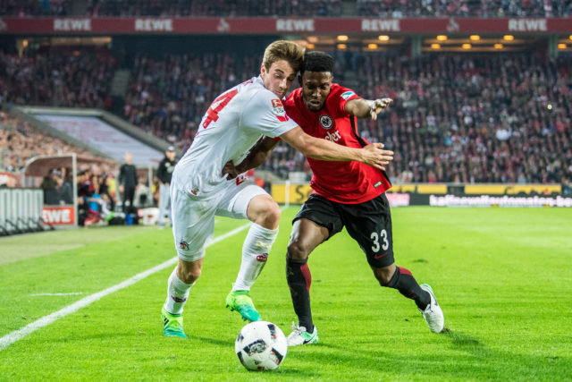 COLOGNE, GERMANY - APRIL 04: Lukas Kluenter (L) of Koeln and Taleb Tawatha (R) of Frankfurt in action during the Bundesliga match between 1. FC Koeln and Eintracht Frankfurt at RheinEnergieStadion on April 4, 2017 in Cologne, Germany.