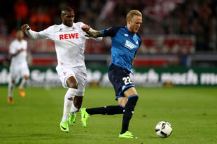 COLOGNE, GERMANY - APRIL 21: Anthony Modeste (L) of Koeln and Kevin Vogt of Hoffenheim battle for the ball during the Bundesliga match between 1. FC Koeln and TSG 1899 Hoffenheim at RheinEnergieStadion on April 21, 2017 i