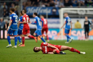 SINSHEIM, BADEN-WUERTTEMBERG - APRIL 03: Lukas Kluenter of 1. FC Koeln lies on the pitch during the Bundesliga match between 1899 Hoffenheim and 1. FC Koeln at Wirsol Rhein-Neckar-Arena on April 3, 2016 in Sinsheim, Germany. 