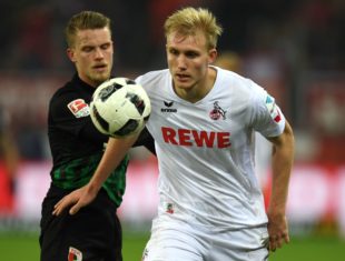 Cologne's Danish defender Frederik Soerensen and Augsburg´s defender Philipp Max vie for the ball during the German first division Bundesliga football match of 1 FC Cologne vs FC Augsburg in Cologne, western Germany, on November 26, 2016. / AFP / PATRIK STOLLARZ / RESTRICTIONS: DURING MATCH TIME: DFL RULES TO LIMIT THE ONLINE USAGE TO 15 PICTURES PER MATCH AND FORBID IMAGE SEQUENCES TO SIMULATE VIDEO. == RESTRICTED TO EDITORIAL USE == FOR FURTHER QUERIES PLEASE CONTACT DFL DIRECTLY AT + 49 69 650050 (Photo credit should read