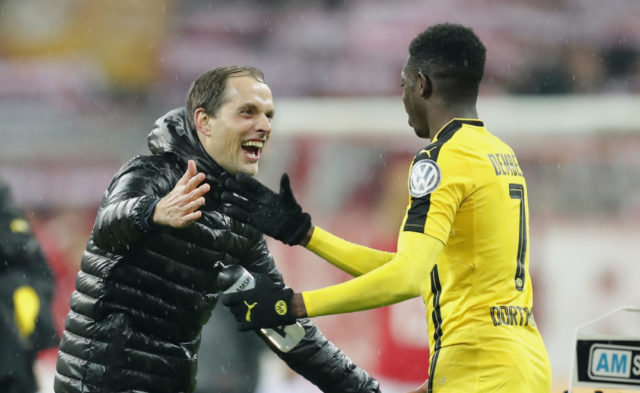 MUNICH, GERMANY - APRIL 26: Head coach Thomas Tuchel of Borussia Dortmund celebrates with Ousmane Dembele of Borussia Dortmund after winning the DFB Cup semi final match between FC Bayern Muenchen and Borussia Dortmund at Allianz Arena on April 26, 2017 in Munich, Germany.