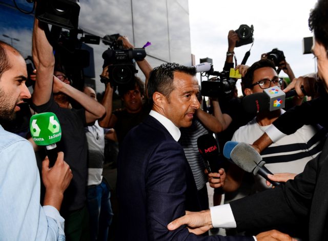 Footballing super-agent Jorge Mendes (C), surrounded by journalists, arrives at the Court in Pozuelo de Alarcon on June 27, 2017 to be questioned by Spanish judge as part of a probe into Colombian striker Radamel Falcao's alleged tax evasion.