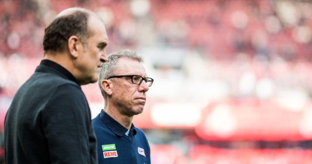 COLOGNE, GERMANY - OCTOBER 15: Manager of Koel Joerg Schmadtke (L) and Head Coach Peter Stoeger stay together prior to the Bundesliga match between 1. FC Koeln and FC Ingolstadt 04 at RheinEnergieStadion on October 15, 2016 in Cologne, Germany. (Photo by Lukas Schulze/Bongarts/Getty Images)