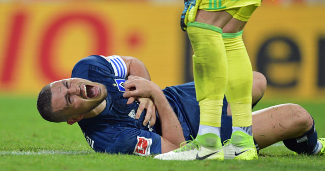 COLOGNE, GERMANY - AUGUST 25: Kyriakos Papadopoulos of Hamburg lies on the pitch in pain during the Bundesliga match between 1. FC Koeln and Hamburger SV at RheinEnergieStadion on August 25, 2017 in Cologne, Germany. (Photo by Lukas Schulze/Bongarts/Getty Images)