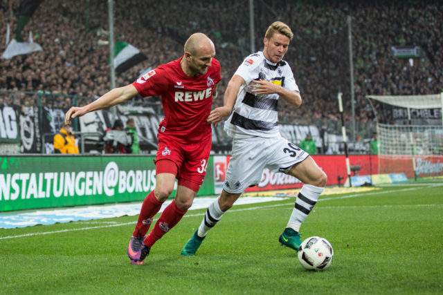 MOENCHENGLADBACH, GERMANY - NOVEMBER 19: Nico Elvedi (R) of Moenchengladbach battles for the ball with Konstantin Rausch of Koeln during the Bundesliga match between Borussia Moenchengladbach and 1. FC Koeln at Borussia-Park on November 19, 2016 in Moenchengladbach, Germany. (Photo by Maja Hitij/Bongarts/Getty Images)