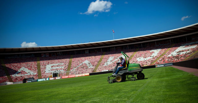 A maintenance worker prepares the pitch at the Red Star Belgrade Marakana stadium on April 27, 2016, 25 years after the Red Star Belgrade European Cup final, an apotheosis of Yugoslav football before the country's bloody collapse. When the crowd hailed Pancev's final goal, the football legend, Red Star technical director at the time Dzajic, opened his eyes to fall into the arms of coach Ljupko Petrovic. The club, where he remains the top scorer, is now only a shadow of what it once was. The same as Marakana which was proud of its capacity of 100,000 people. / AFP / ANDREJ ISAKOVIC (Photo credit should read ANDREJ ISAKOVIC/AFP/Getty Images)