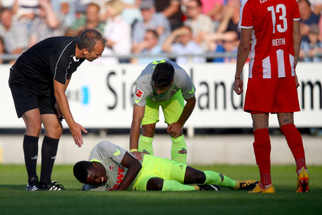 HAIGER, GERMANY - AUGUST 07: Milos Jojic care of Jhon Cordoba of Koeln after an injury during the preseason friendly match between TSV Steinbach and 1. FC Koeln at Sibre-Sportzentrum Haarwasen on August 7, 2017 in Haiger, Germany. (Photo by Christof Koepsel/Bongarts/Getty Images)