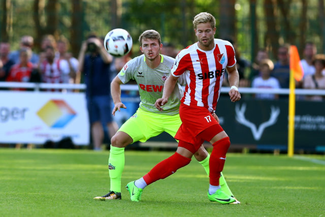 HAIGER, GERMANY - AUGUST 07: Saschas Marquet of Steinbach challenges Jannes Horn of Koeln during the preseason friendly match between TSV Steinbach and 1. FC Koeln at Sibre-Sportzentrum Haarwasen on August 7, 2017 in Haiger, Germany. (Photo by Christof Koepsel/Bongarts/Getty Images)