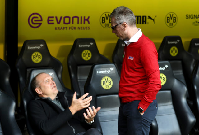 DORTMUND, GERMANY - SEPTEMBER 17: Peter Stoeger (R), head coach of Koeln talks to sport director Joerg Schmadtke before the Bundesliga match between Borussia Dortmund and 1. FC Koeln at Signal Iduna Park on September 17, 2017 in Dortmund, Germany. (Photo by Martin Rose/Bongarts/Getty Images)