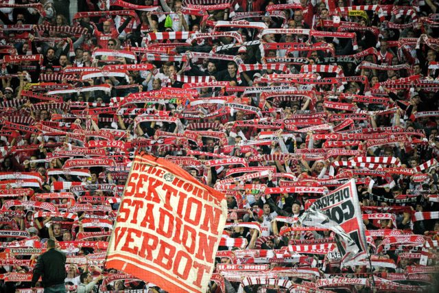 Cologne's supporters cheer their team during the German first division Bundesliga football match Borussia Dortmund v FC Cologne in Dortmund, western Germany, on September 17, 2017. / AFP PHOTO / SASCHA SCHUERMANN / RESTRICTIONS: DURING MATCH TIME: DFL RULES TO LIMIT THE ONLINE USAGE TO 15 PICTURES PER MATCH AND FORBID IMAGE SEQUENCES TO SIMULATE VIDEO. == RESTRICTED TO EDITORIAL USE == FOR FURTHER QUERIES PLEASE CONTACT DFL DIRECTLY AT + 49 69 650050 (Photo credit should read SASCHA SCHUERMANN/AFP/Getty Images)