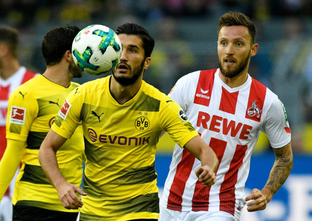 Dortmund's Turkish midfielder Nuri Sahin (L) and Cologne's midfielder Marco Hoeger vie for the ball during the German first division Bundesliga football match Borussia Dortmund v FC Cologne in Dortmund, western Germany, on September 17, 2017. / AFP PHOTO / SASCHA SCHUERMANN / RESTRICTIONS: DURING MATCH TIME: DFL RULES TO LIMIT THE ONLINE USAGE TO 15 PICTURES PER MATCH AND FORBID IMAGE SEQUENCES TO SIMULATE VIDEO. == RESTRICTED TO EDITORIAL USE == FOR FURTHER QUERIES PLEASE CONTACT DFL DIRECTLY AT + 49 69 650050 (Photo credit should read SASCHA SCHUERMANN/AFP/Getty Images)
