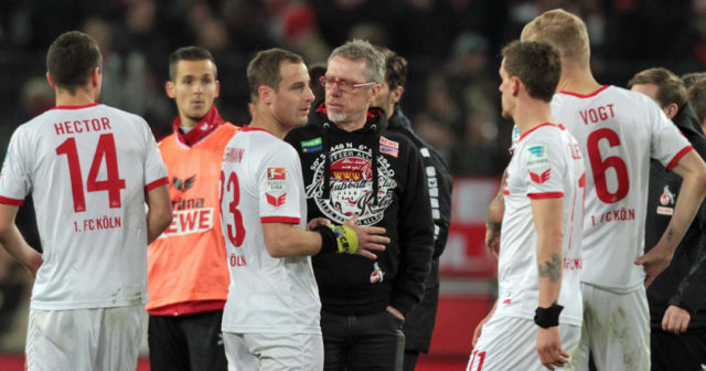 COLOGNE, GERMANY - NOVEMBER 21: Manager Peter Stoeger of Cologne (C) talks to Matthias Lehmann after the Bundesliga match between 1. FC Koeln and 1. FSV Mainz 05 at RheinEnergieStadion on November 21, 2015 in Cologne, Germany. (Photo by Juergen Schwarz/Bongarts/Getty Images)